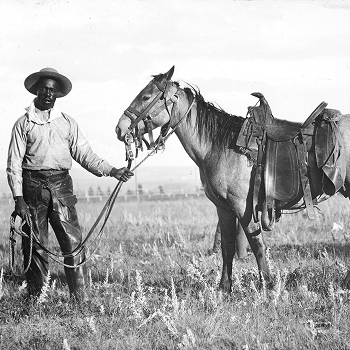 vaquero negro y caballo