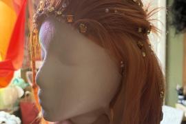 This is a wig I made to cosplay the character cater diamond from twisted wonderland. It as a glued hairline and has gemstones glued to it 