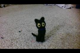 a needle felted black cat