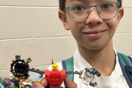 A Lego minifig in a mech suit