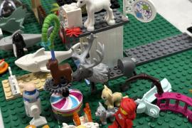 Lego creation of people and animals lined up in a scene. 