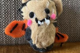 It is a small bat stuffy.