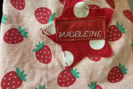 Used a sewing machine and picked out the cute strawberry fabric for summer