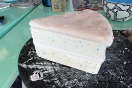 Clay birthday cake with frosting and sprinkles 