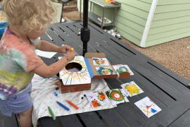 A kit to make spin art and dropping paint to create the art
