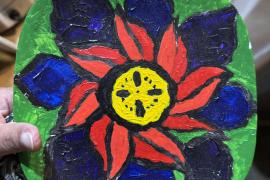 Colorful painted plate, using a swirl flower design