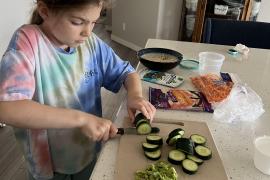 Cutting up cucumbers 