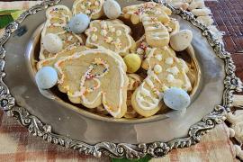 dinosaur cookies in silver dish