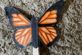 Butterfly colored, cut out and glued to a clothes pin. Wings move when clothes pin is open.