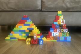 Duplos in two mountain or hill formations. One shorter and wider, one taller and thinner.