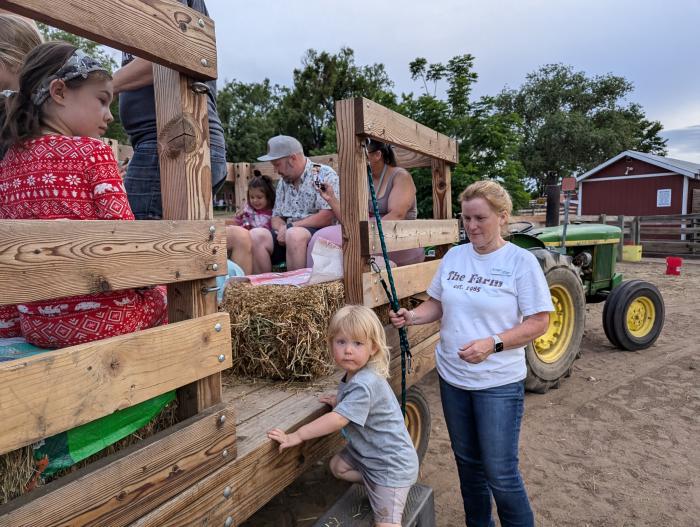 Climbing the wagon for a hay ride 