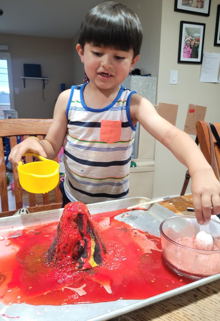 Building his own volcano and make it erupt.