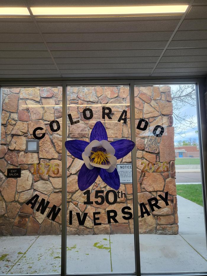 Columbine  made out of white paper and painted purple and yellow  wording printed from pinterest