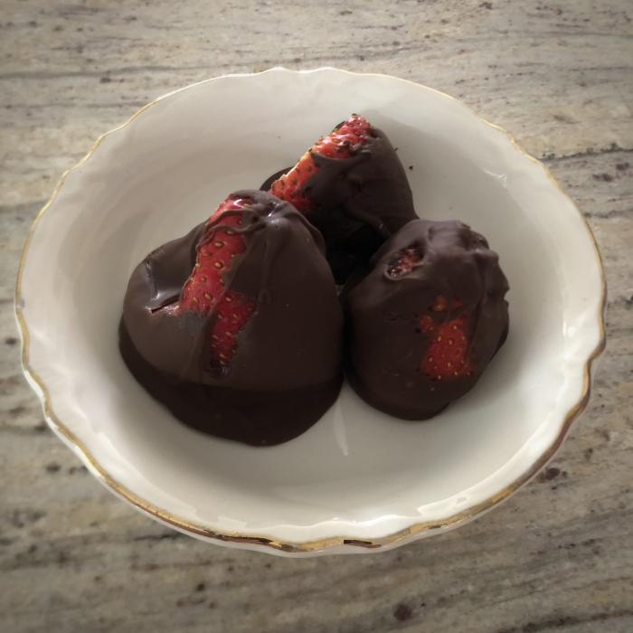 three chocolate covered strawberries
