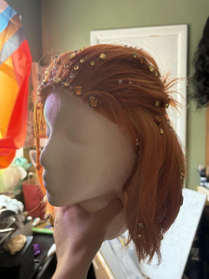 This is a wig I made to cosplay the character cater diamond from twisted wonderland. It as a glued hairline and has gemstones glued to it 