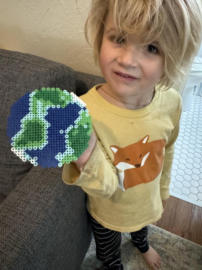 We placed correct color beads in the correct place and then ironed them together to create the earth.