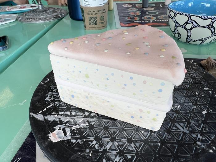 Clay birthday cake with frosting and sprinkles 