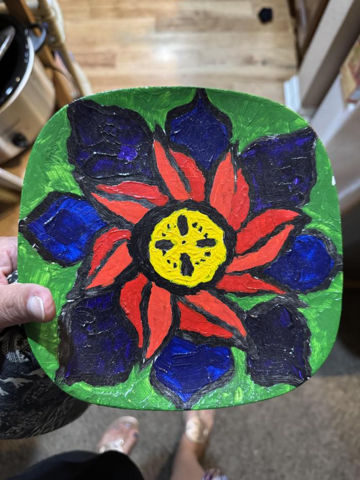 Colorful painted plate, using a swirl flower design