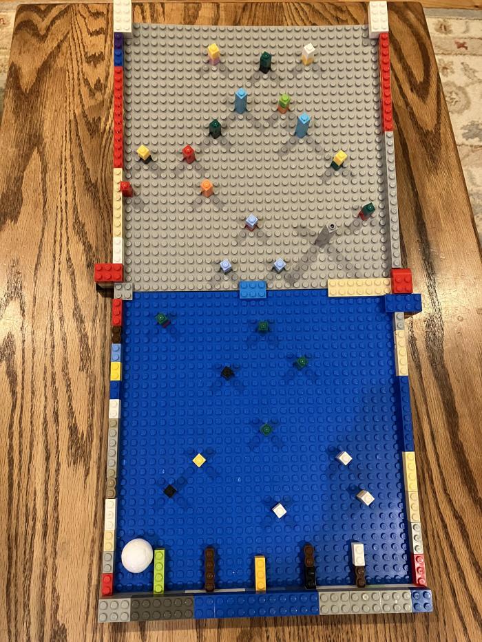 Coin drop carnival game made out of legos