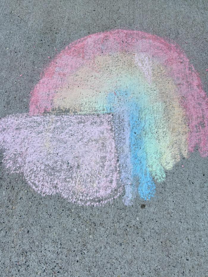 chalk rainbow peaking out of a cloud