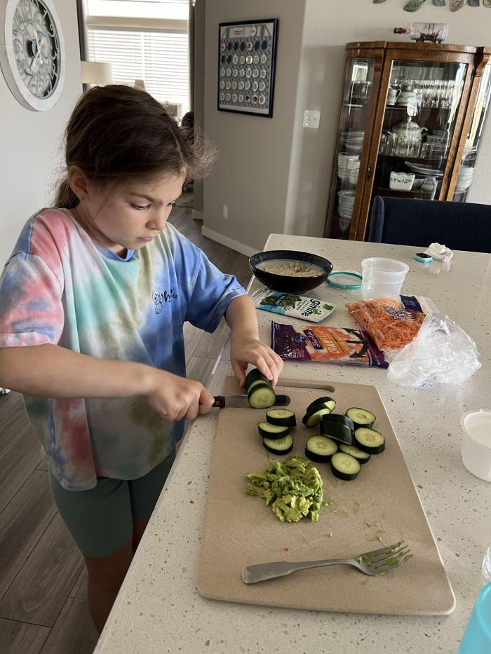 Cutting up cucumbers 