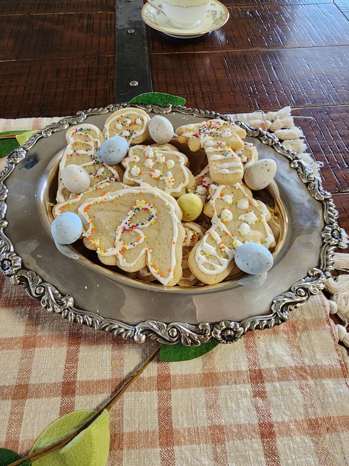 dinosaur cookies in silver dish