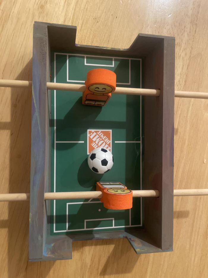 A small soccer game, similar to foosball