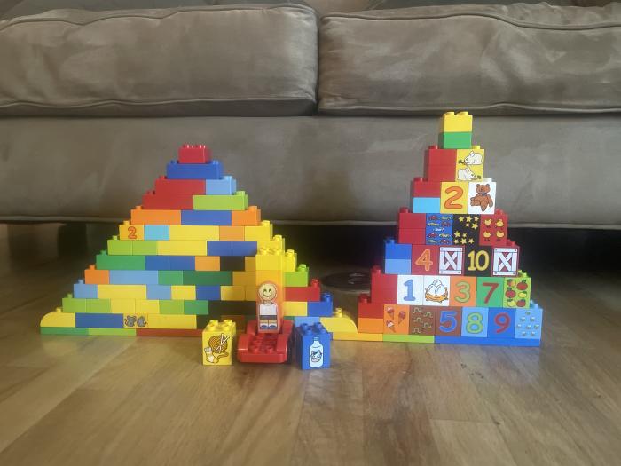 Duplos in two mountain or hill formations. One shorter and wider, one taller and thinner.