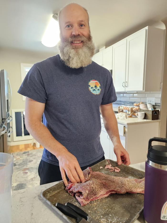 bearded man making bacon